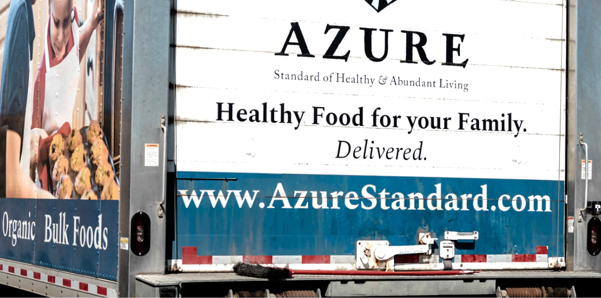 Photo of Azure Standard delivery truck from behind.